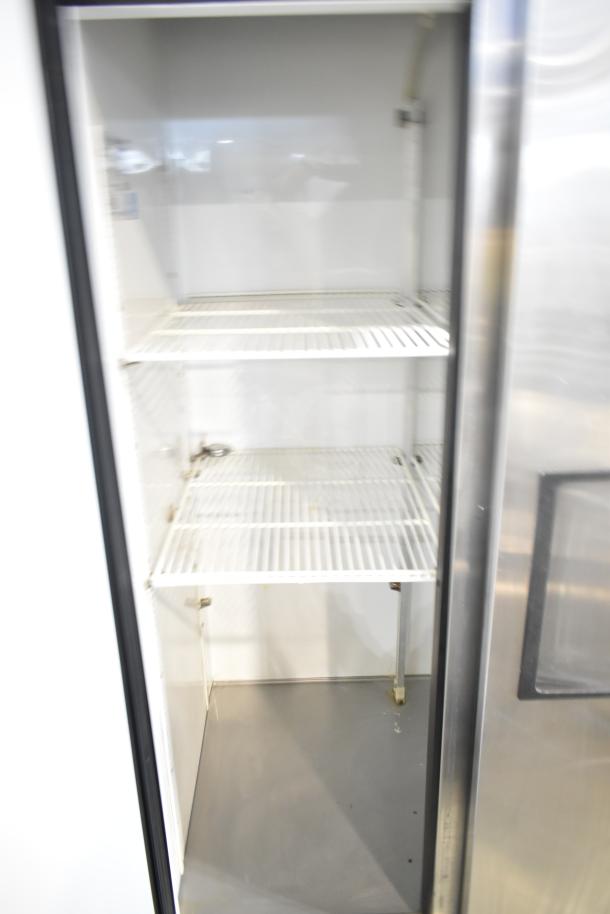 True T-35 Commercial 2 Door Reach-In Cooler, 115V, 1 Phase, with shelves. Stainless exterior, interior clean, good condition.