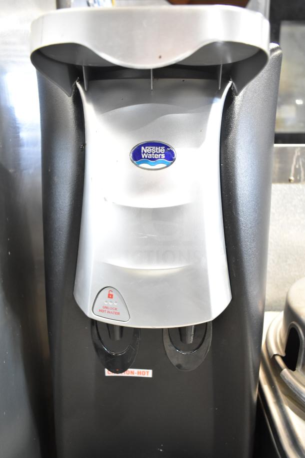 SOBP210ESNS countertop water dispenser, Nestle Waters branding, dual taps, 115V, 1 phase. Caution-hot label visible.