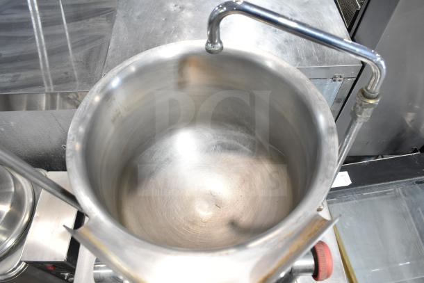 Cleveland 24EMK624 commercial 6-gallon steam jacketed kettle with tilting feature and modular generator base, appears in good condition.