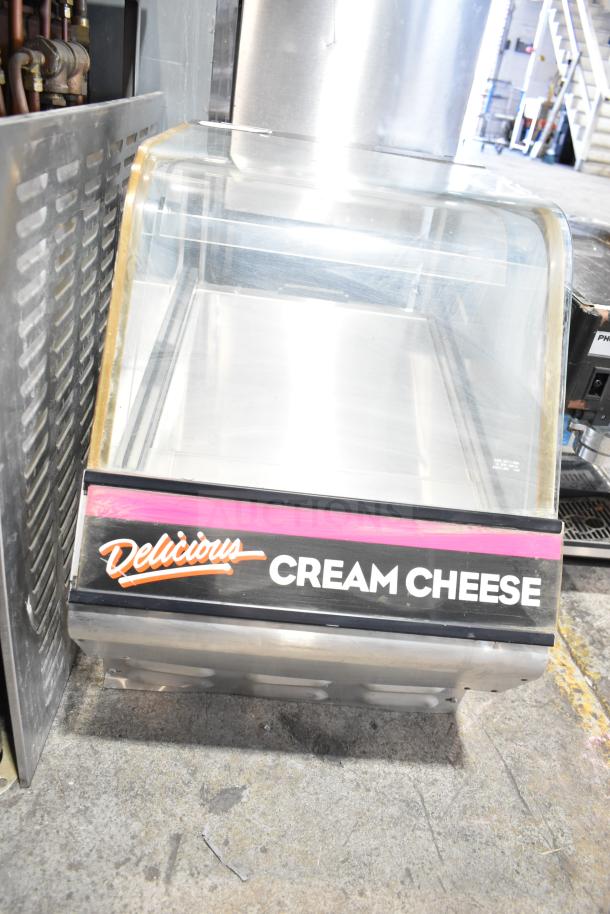 Structural Concepts DD17R Refrigerated Dual Service Merchandiser, 120V, 1-phase, clear display, "Delicious Cream Cheese" label.