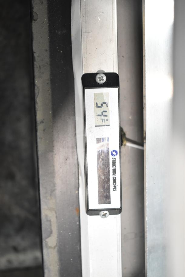 Structural Concepts DD17R display showing temperature at 54°F. Digital display with brand logo visible.