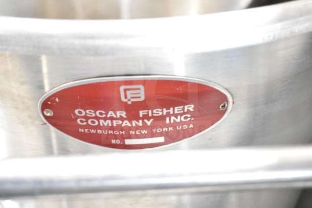 Oscar Fisher stainless steel tank with label showing company name and location. Appears in good condition.