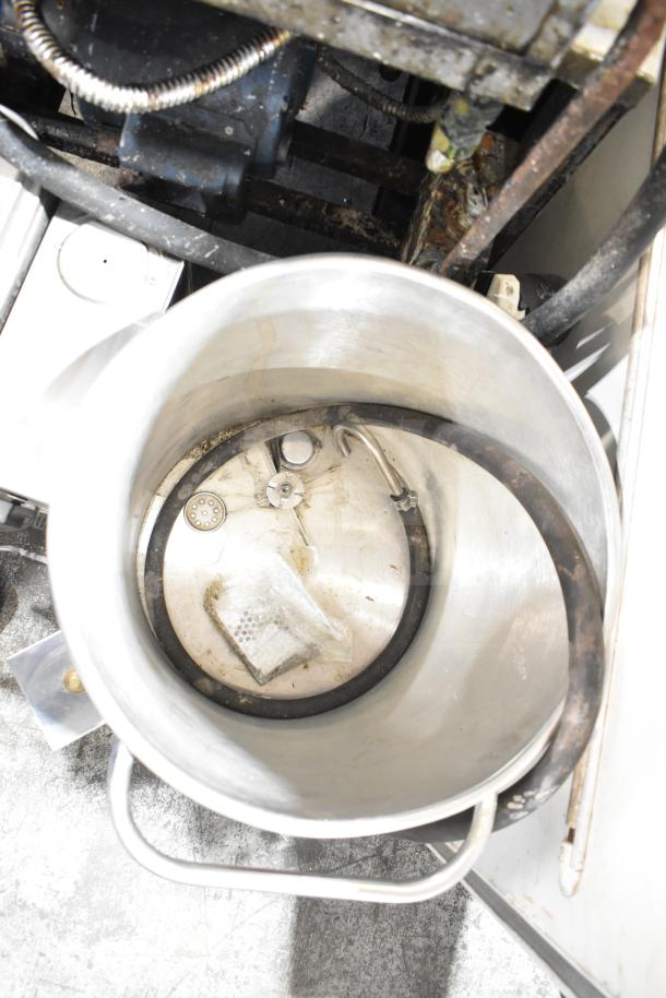 Oscar Fisher stainless steel tank, used condition, with attached metal handle and visible hoses inside.