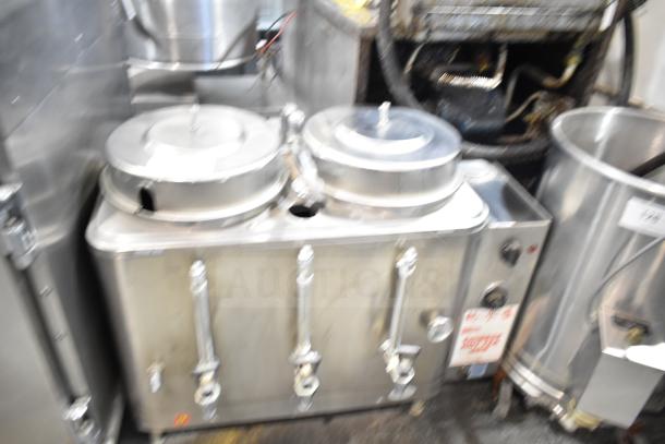 Cecilware Commercial Countertop Hot Tea Urn with dual lids and three spigots in stainless steel, showing usage wear.