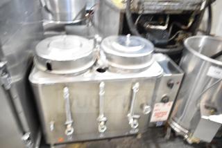 Cecilware Commercial Countertop Hot Tea Urn with dual lids and three spigots in stainless steel, showing usage wear.