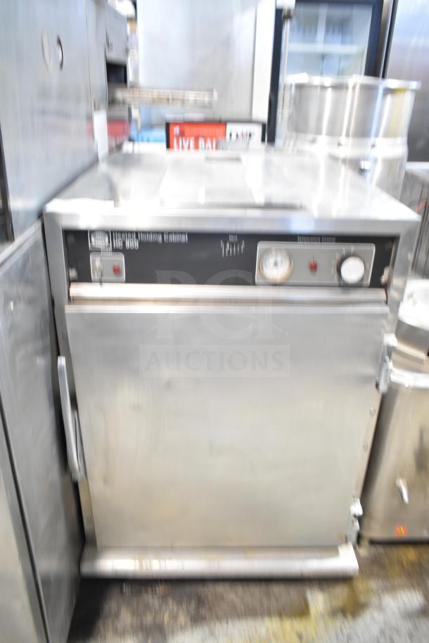 Henny Penny HC900 Heated Holding Cabinet with commercial casters, 115V, 1 Phase. Front panel with controls and gauge.
