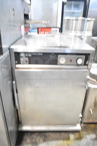 Henny Penny HC900 Heated Holding Cabinet with commercial casters, 115V, 1 Phase. Front panel with controls and gauge.