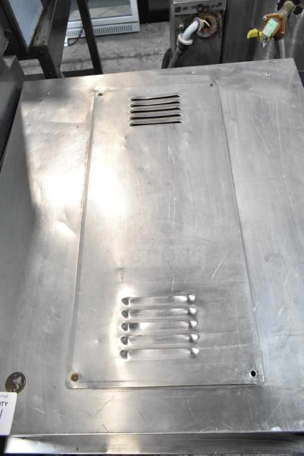 Henny Penny HC900 heated holding cabinet with steel exterior, commercial casters, and ventilation slits, 115 volts, 1 phase.