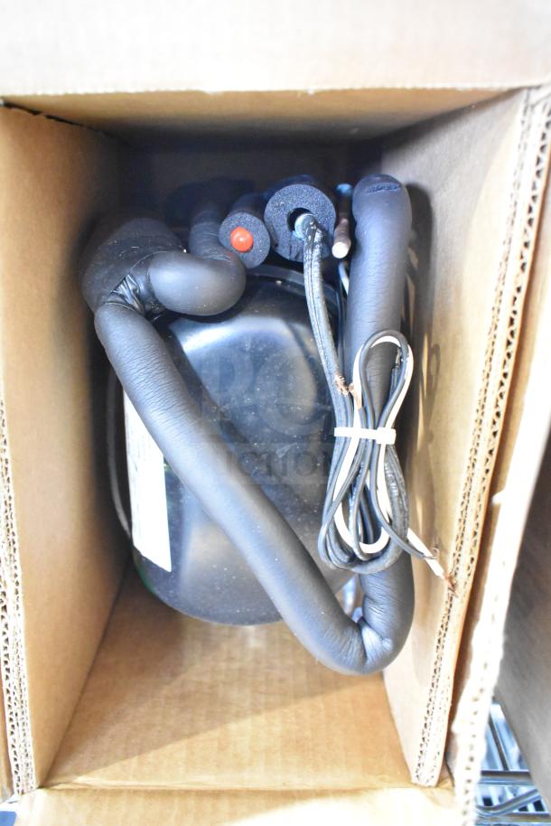 Baxter Mini-K Compressor in box. 115 volts, 1 phase. Black finish with coiled wire. Like new condition.