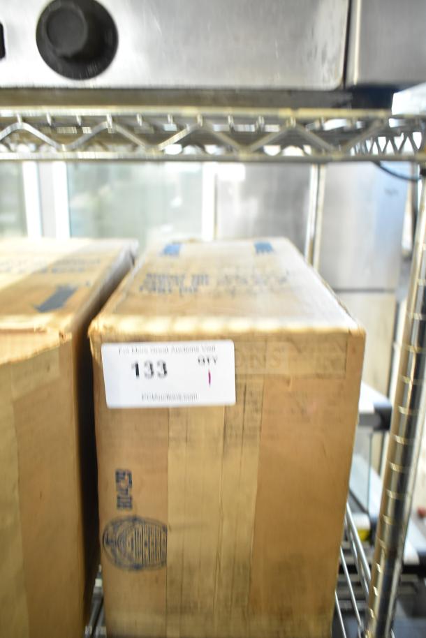 Baxter Mini-K Compressor in box, 115 volts, 1 phase. Packaging shows model details and auction label "133".