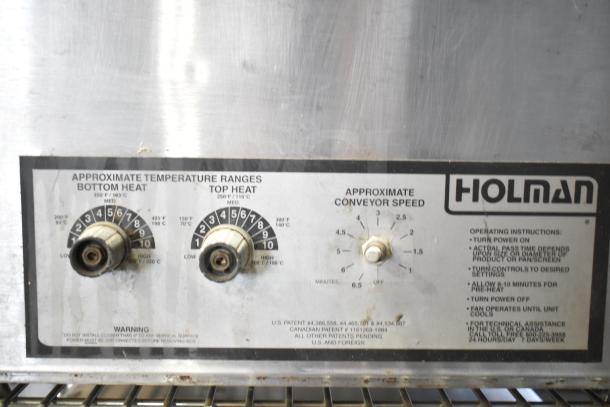 Holman 214HX Conveyor Oven control panel, showing temperature and speed dials, operational instructions, and branding.
