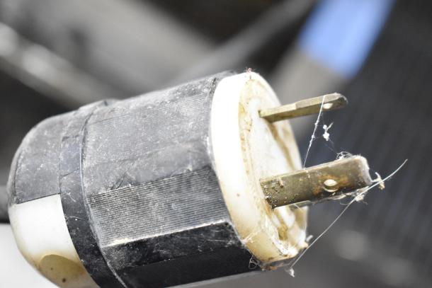 Close-up of the power plug of a Star Holman RCS-R2-12BASH countertop conveyor oven. Plug shows signs of wear.