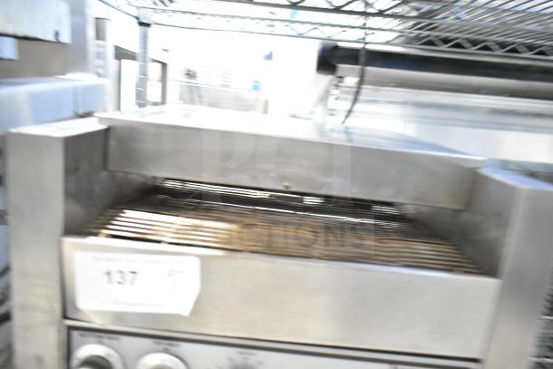 Holman countertop electric conveyor oven, stainless steel, visible control knobs, auction tag labeled "137".
