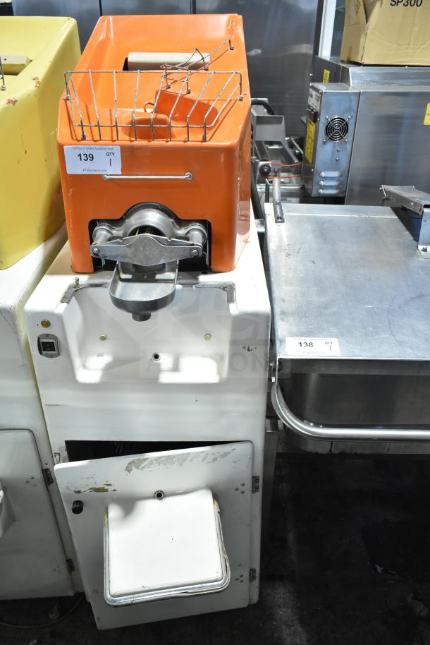 Juice Tree 106 Commercial Citrus Juicer, floor style, 115 volts, 1 phase, orange casing, visible wear, auction tag 139.