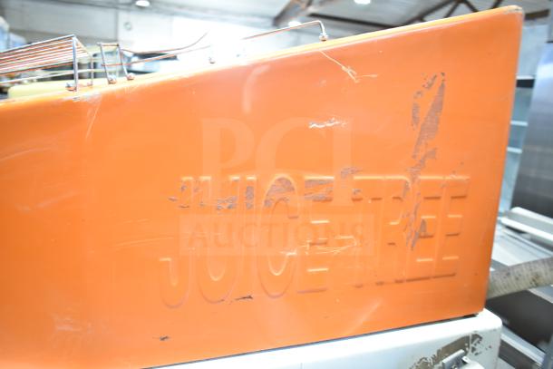 Juice Tree 106 Citrus Juicer, commercial floor style, orange casing, visible wear, 115 volts, 1 phase, embossed logo.