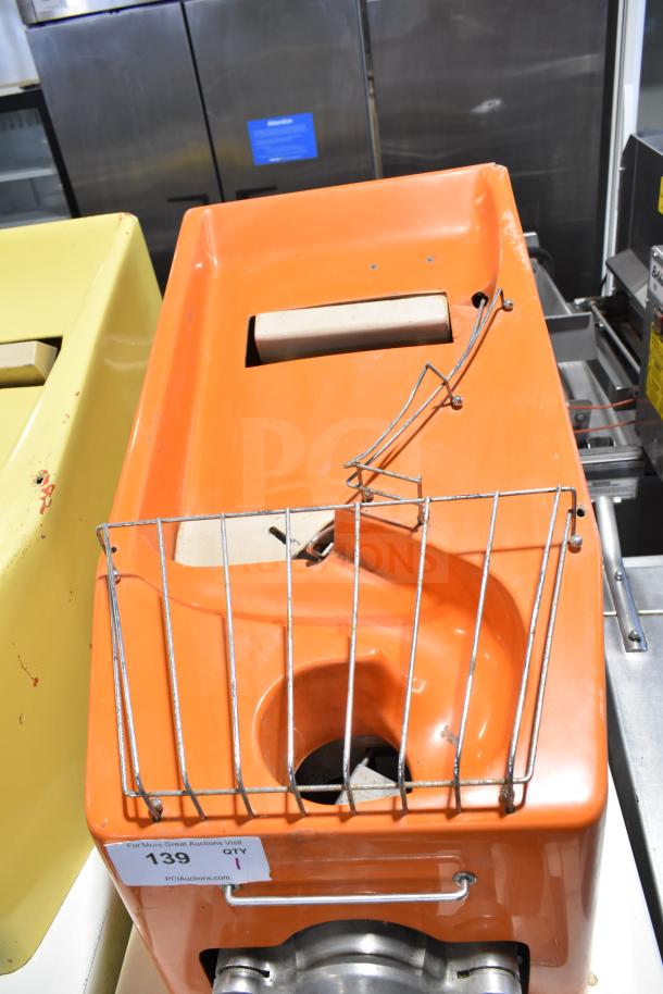 Juice Tree 106 Commercial Citrus Juicer, 115V, 1 Phase, orange casing, floor style. Features include wire safety guard.