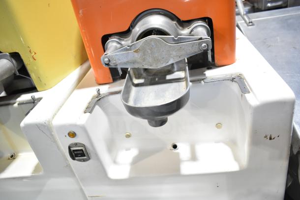 Juice Tree 106 commercial floor citrus juicer, orange casing. 115 volts, 1 phase. Visible wear, includes spout and switch.