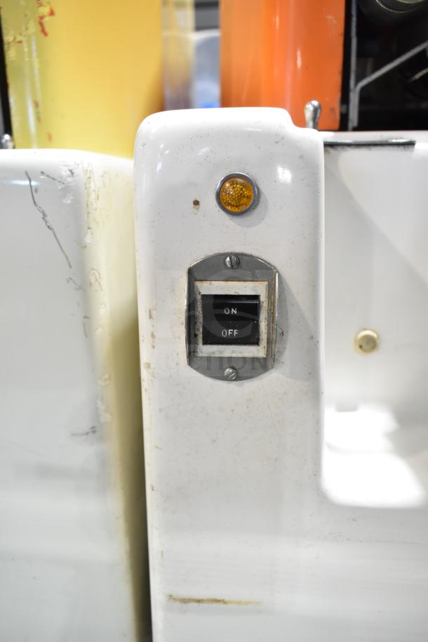 Juice Tree 106 commercial citrus juicer, floor style, with on/off switch and indicator light. Operates on 115 volts, 1 phase.