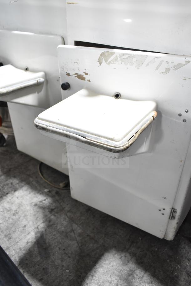 Juice Tree 106 Commercial Citrus Juicer, floor style, 115 volts, 1 phase. Visible wear on white exterior.