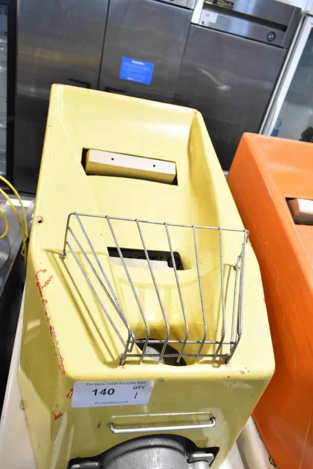 Juice Tree 105 Commercial Citrus Juicer, floor model, 115V, visible wear, metal basket, auction tag reading "140".