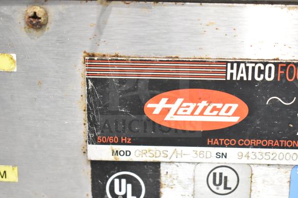 Hatco GRSDS/H-36D display shelf label showing model, 50/60 Hz frequency, and UL certification. Surface shows wear.