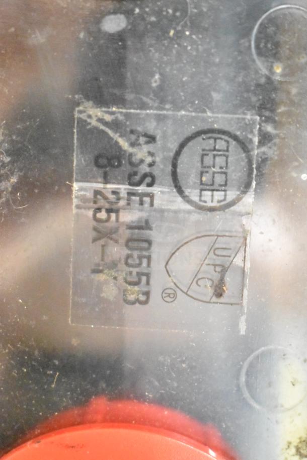 Close-up of Blend Buddy Wall Mounting Dispensing System showing ASSE 1055B and UPC certification markings.