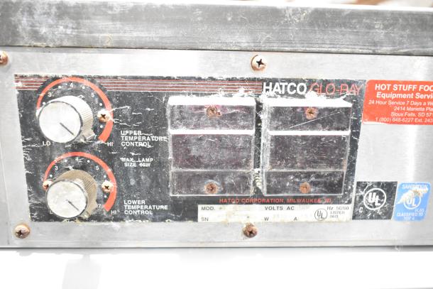 Hatco GRSDS-36D commercial heated display controls with visible dials for temperature settings; scratched metal panel.