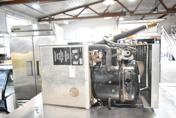 Larco Electric Water Cooler, 115 Volts, 1 Phase. Features visible label detailing model and specifications. Industrial setting.