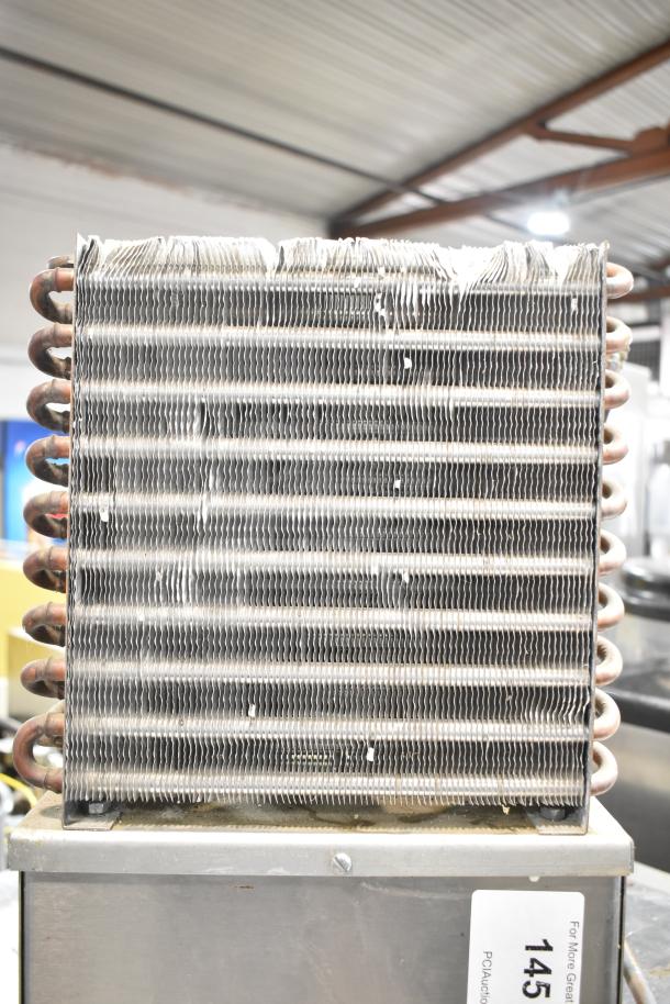 Larco Electric Water Cooler, 115 Volts, 1 Phase. Metal coils visible, used condition, label marked "145."