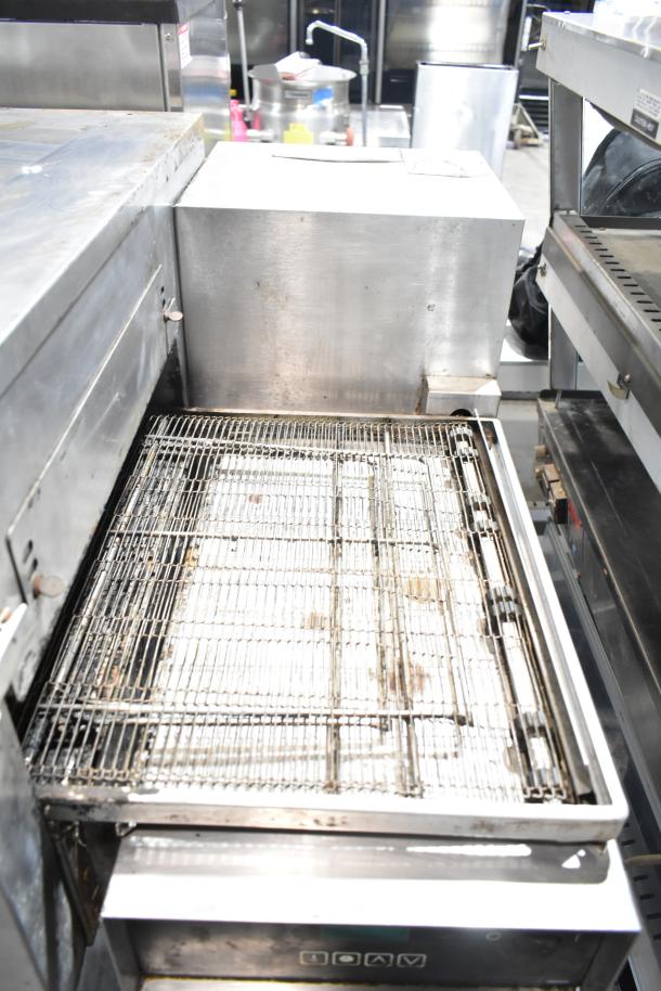 Lincoln Impinger commercial conveyor pizza oven on stand, used condition, stainless steel finish, visible control panel.