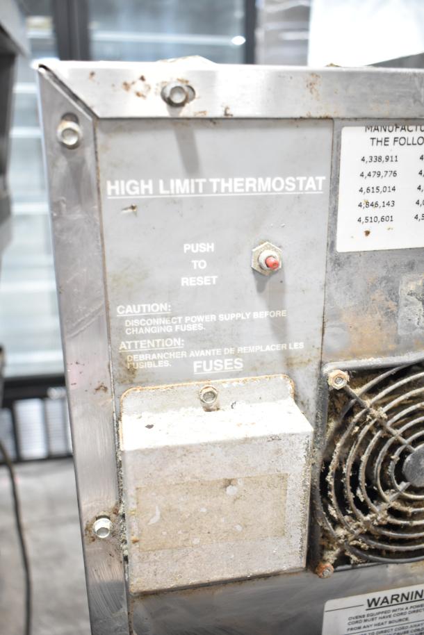 Lincoln Impinger Commercial Conveyor Pizza Oven, visible high limit thermostat panel, used condition, mounted on stand.