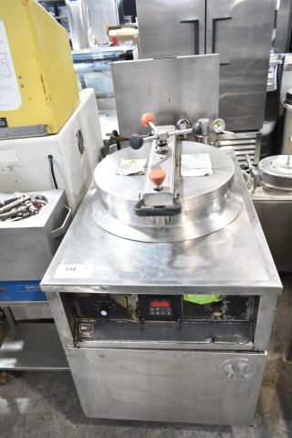BKI FKM-F electric pressure fryer on casters, 208/230V, 3-phase. Features control panel, pressure gauge, and safety labels.