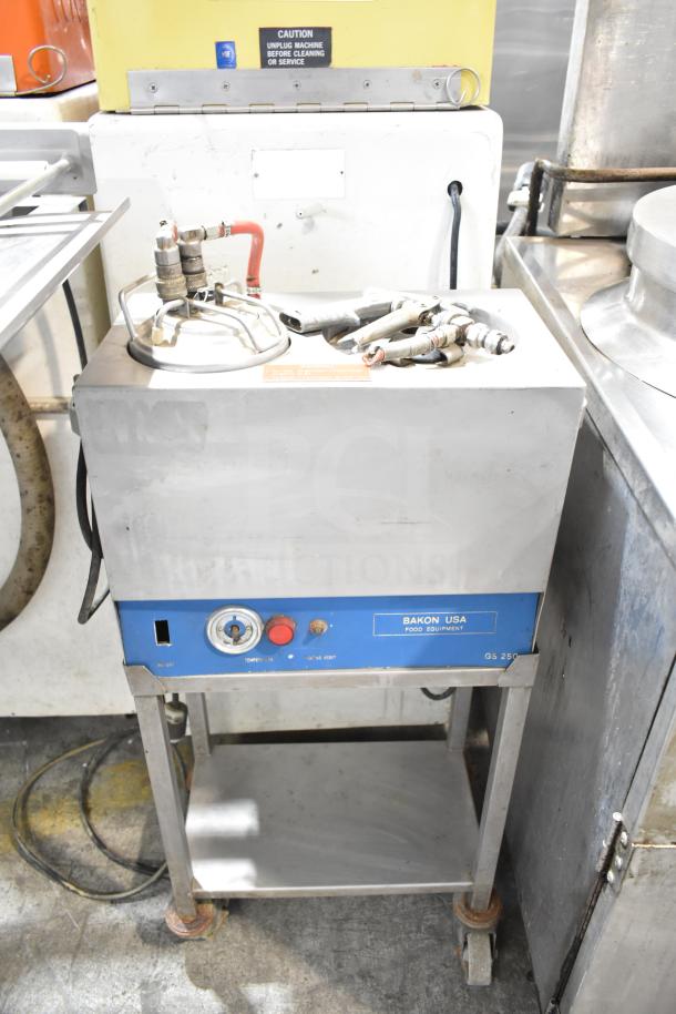 Bakon GS 250 Commercial Unit on casters, 110 volts, 1 phase. Features control dials and Bakon USA label. Good condition.