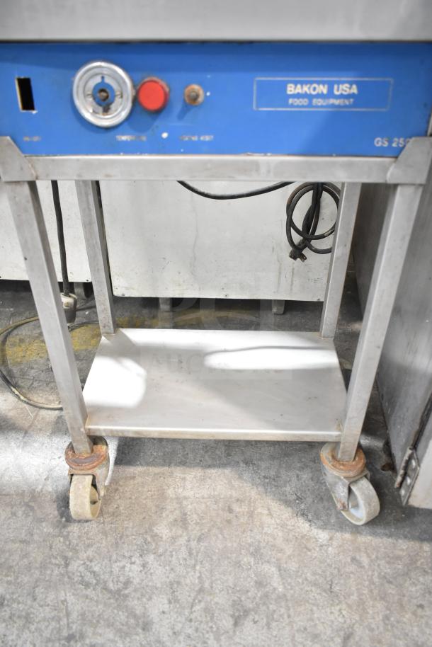 Bakon GS 250 commercial unit on casters, 110V, 1 phase. Blue control panel with buttons and Bakon USA Food Equipment label.