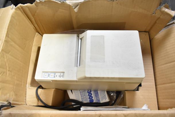 Belshaw TG50, used condition, with Star SP300 receipt printer in box. Visible power, paper feed buttons.