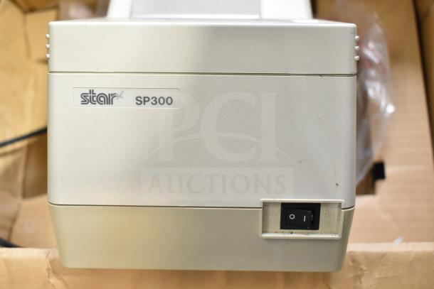 Star SP300 Receipt Printer, light gray, slight wear, power switch visible.