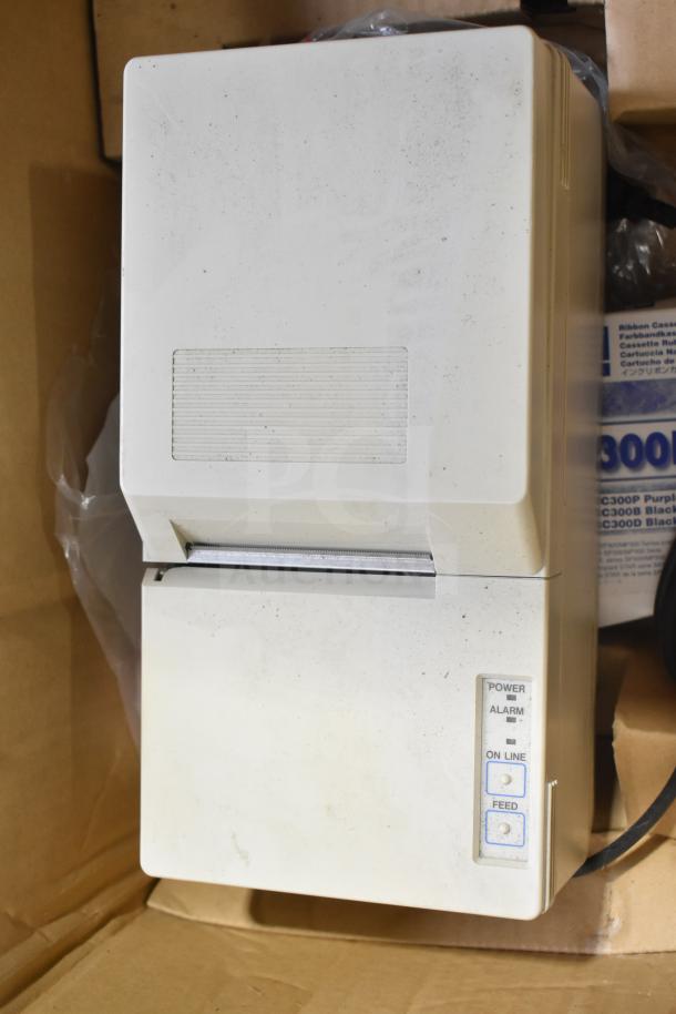 Belshaw TG50 receipt printer in used condition with visible control buttons. Includes soap dispenser. Auction lot of 2 items.