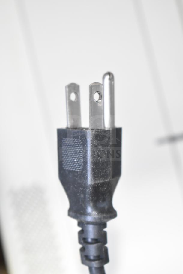 Close-up of a power plug for a Belshaw TG50 item, set against a blurred white background.