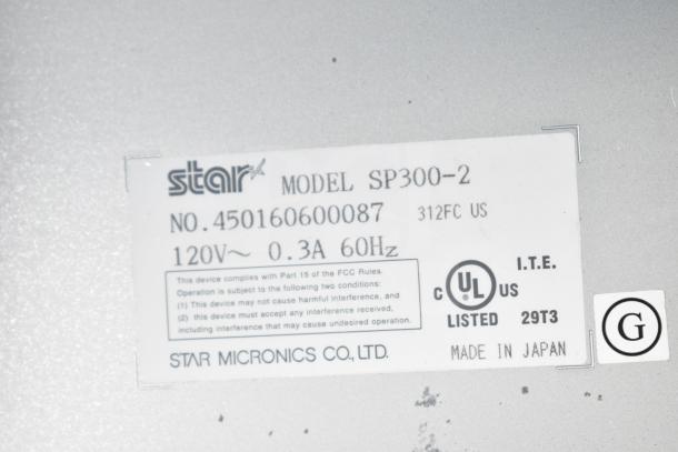 Star SP300-2 receipt printer label showing model, serial number, and compliance details. Made in Japan.