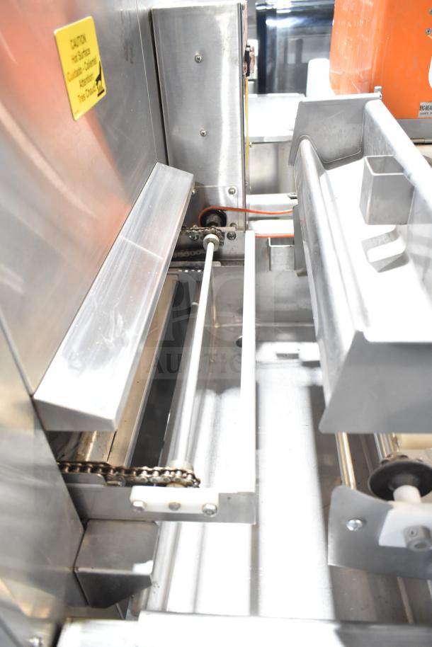 Belshaw TG50 thermoglazing station, stainless steel, commercial-grade with casters. 208V, 1 phase. Caution label visible.