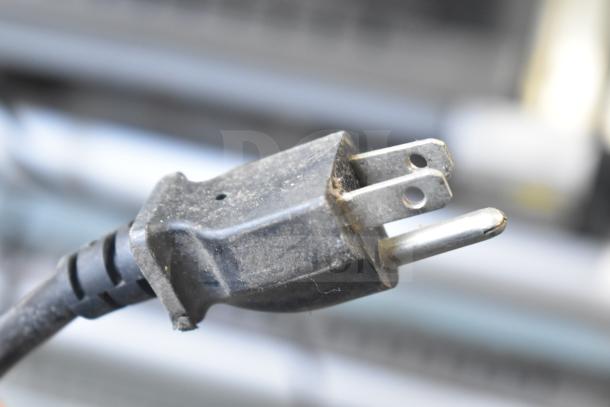 Close-up of a power plug attached to the Hatco GR2SDH-30 commercial warming display, showing three-prong configuration.