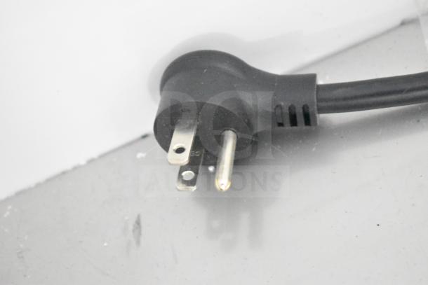 Close-up of a power plug for the 2022 True TSCI-600R-G-PH commercial cooler, 115 volts, single phase.