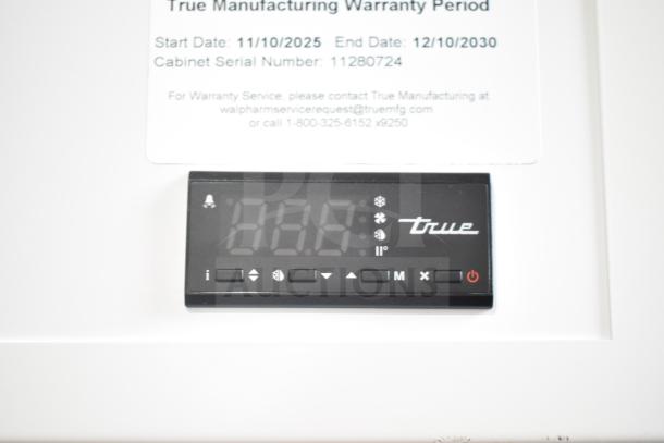 True TSCI-600R-G-PH cooler control panel; digital display with brand logo. Warranty details indicate coverage, serial 11280724.