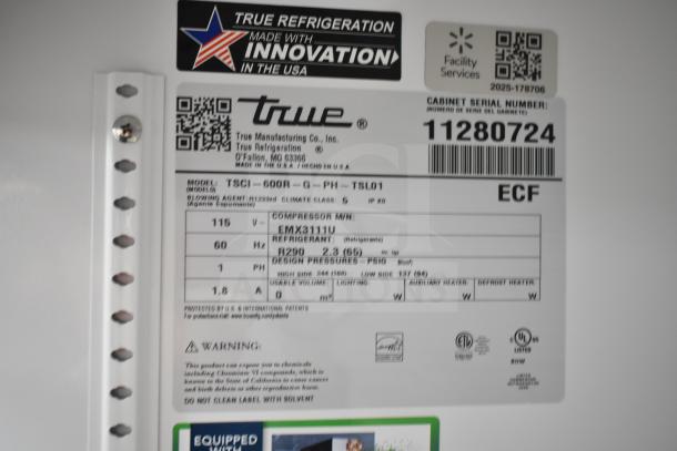 Label of 2025 True TSCI-600R-G-PH cooler, 115V, 1 phase, compressor model EMX3111U, shows serial number and specs.