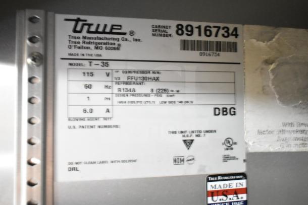 Label on 2016 True T-35 cooler indicating model, 115 volts, 1 phase, refrigerant R134A, made in USA, serial number 8916734.
