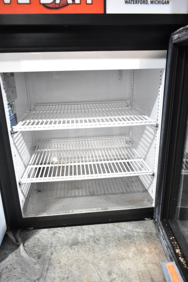 True GDM-05-HC commercial mini cooler, single glass door, three interior shelves, 115 volts, visible interior label, clean condition.