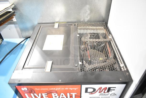 True GDM-05-HC mini cooler merchandiser, 115 volts, single door. Features live bait decals, visible wear on top.