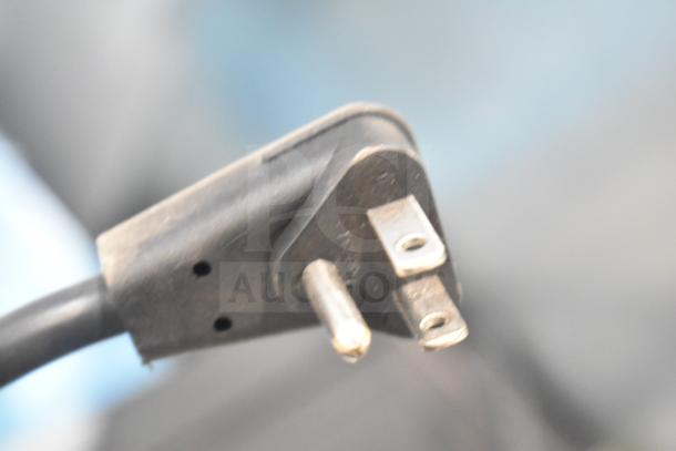 True GDM-05-HC mini cooler power plug, 115 volts, 1 phase, black cord, close-up view.