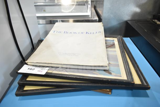 6 items: "The Book of Kells" book, 5 framed pictures. Book cover shows wear; pictures have black frames. Auction lot 162.