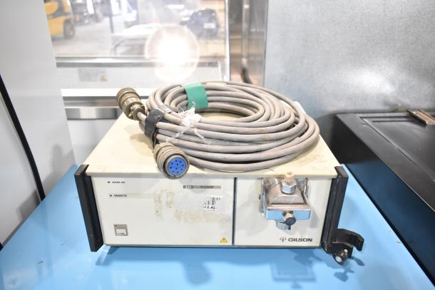 Gilson HPLC system with UV/Vis detector, includes coiled cable, model 306 pump, visible wear, label marked "306 PUMP".